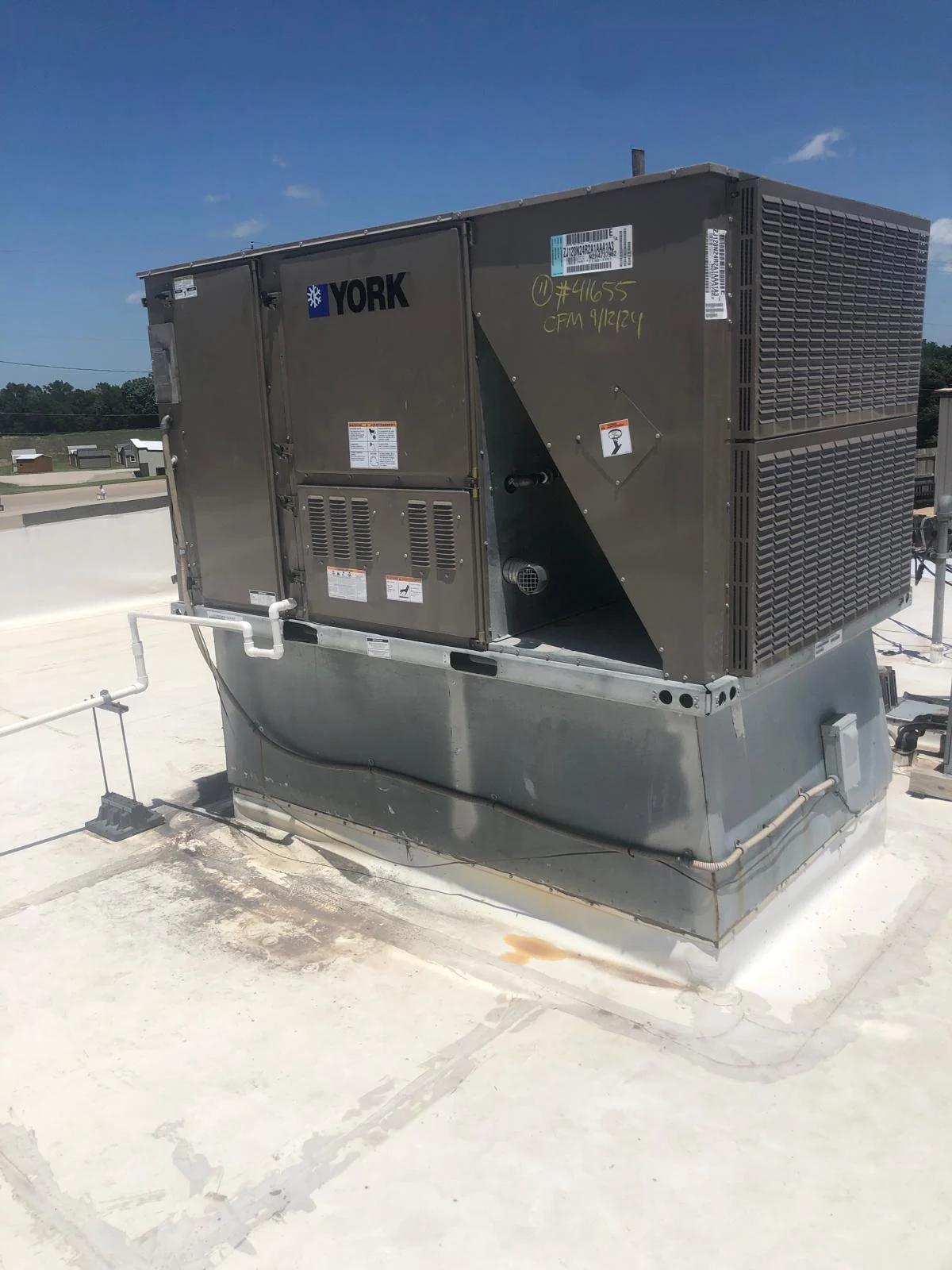 York commercial rooftop HVAC unit installation with PVC drain